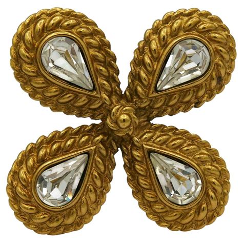 Brooches Yves Saint Laurent for women .